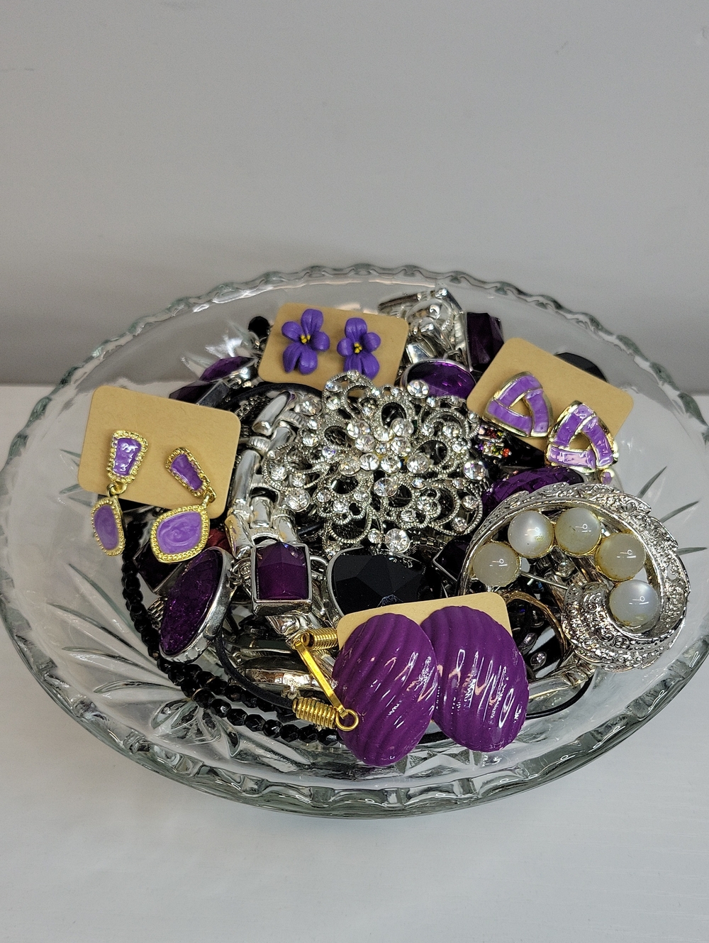 Assorted Jewelry In A Glass Dish
